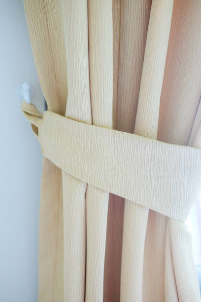 istock Curtain knob with bow as a decoration in home 1016497582