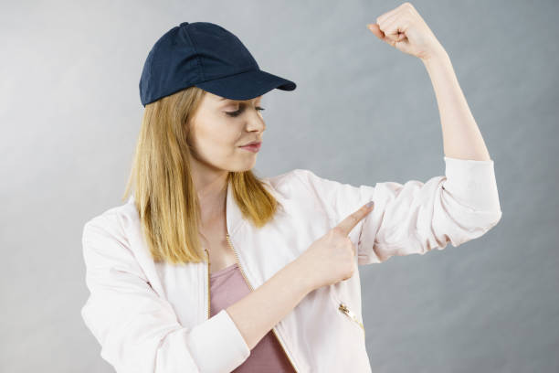 istock Young woman showing her arm muscles 1016497748
