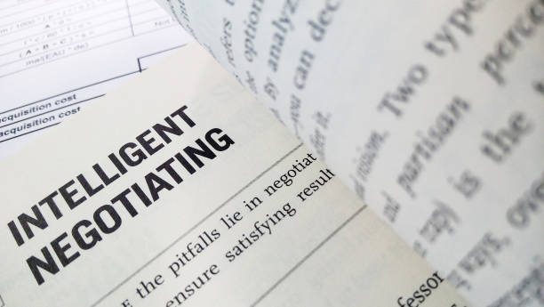 istock Intelligent negotiatiing word on the book 1016498176