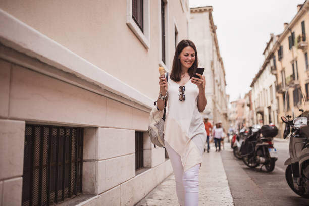 istock Young women tourist discovering Italy, using mobile phone 1016505326
