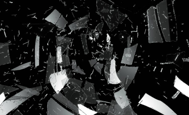 istock Shattered or damaged glass Pieces on black 1016507552