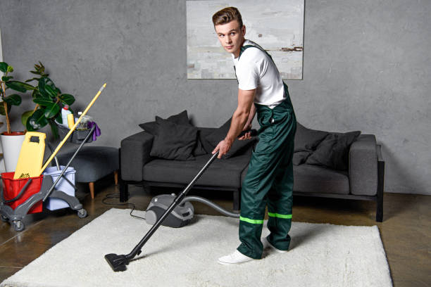 istock young professional cleaning company worker using vacuum cleaner 1016518296