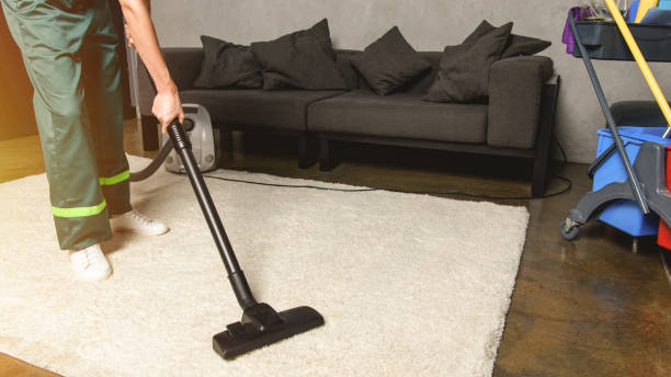 istock partial view of person using vacuum cleaner while cleaning white carpet 1016518352