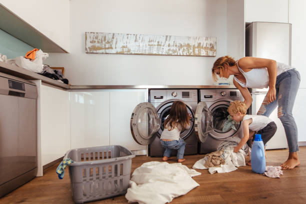 istock Family doing laundry together at home 1016529018