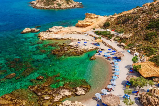 Sea skyview landscape photo of picturesque beach near Stegna and Archangelos on Rhodes island, Dodecanese, Greece. Panorama with sand and clear blue water. Famous tourist destination in South Europe