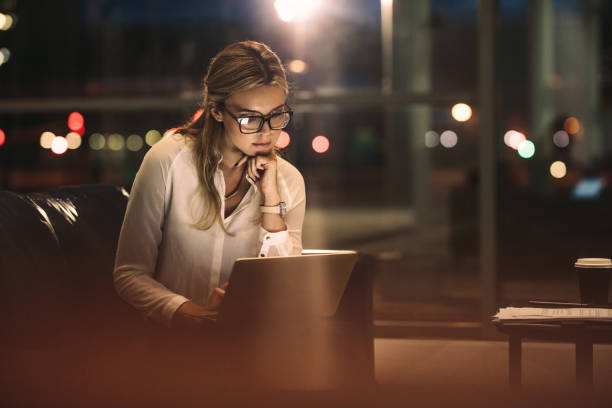 istock Business woman working late on laptop 1016537672