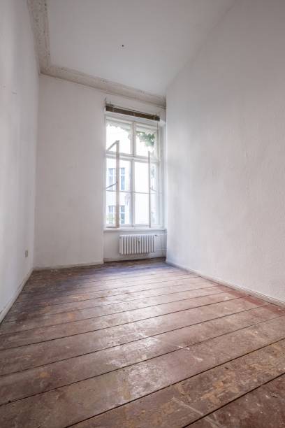 istock empty room with old wooden floor - apartment renovation concept 1016540642