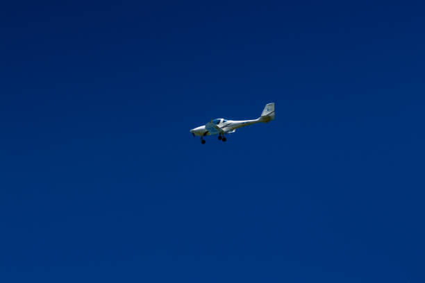 istock The plane flies in the blue sky 1016540652