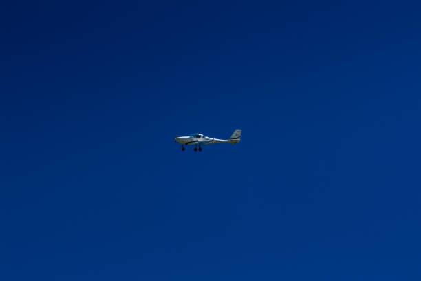 istock The plane flies in the blue sky 1016540678