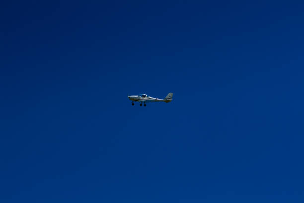 istock The plane flies in the blue sky 1016541308