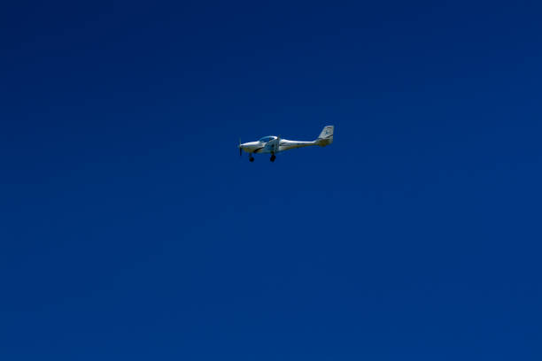 istock The plane flies in the blue sky 1016541404