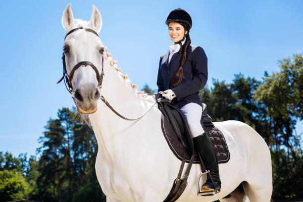 istock Successful female rider feeling happy after winning competition 1016541534