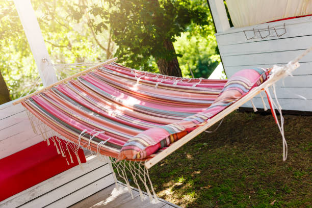istock A stripped hammock hanging in the garden 1016546924