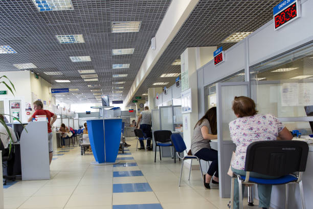 Interior of a multifunctional center for the provision of public services Moscow, Russia - June 27, 2017: Interior of a multifunctional center for the provision of public services public service employee stock pictures, royalty-free photos & images
