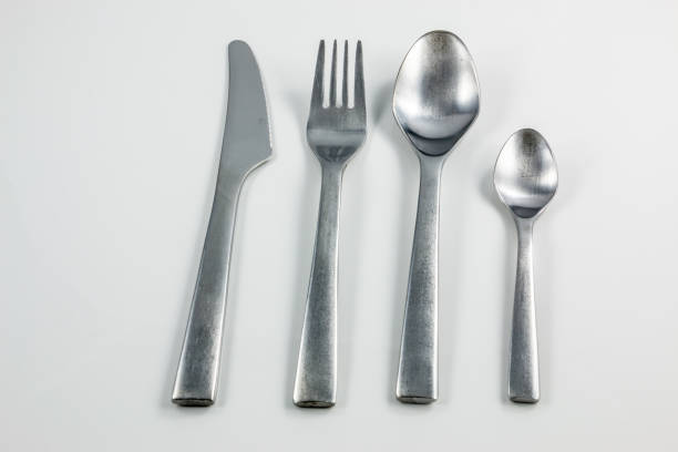istock Cutlery with knife, fork, table spoon and little spoon 1016565098