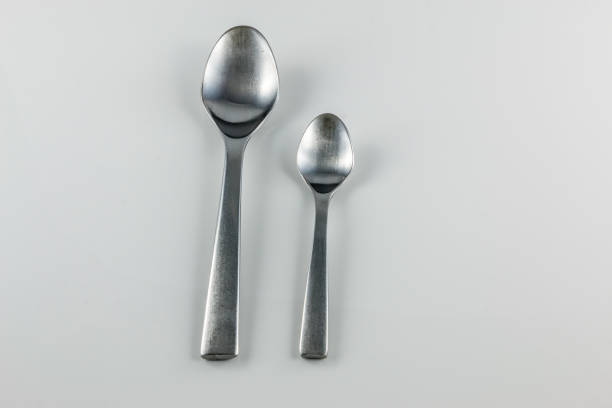 istock Steel cutlery with table spoon and little spoon 1016567192