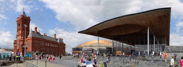 Panorama of crowds of people visiting Eisteddfod week in Cardiff Bay 2018 Cardiff, Cardiff Bay, Wales - August 4th 2018. Panorama of crowds of people visiting Eisteddfod week in Cardiff Bay 2018 national assembly for wales stock pictures, royalty-free photos & images