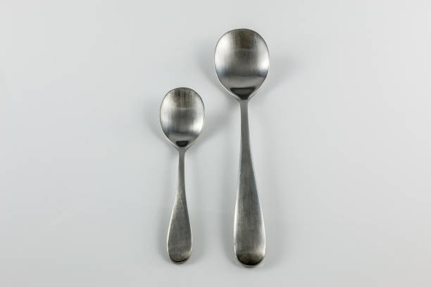 istock Steel cutlery with table spoon and little spoon 1016567314