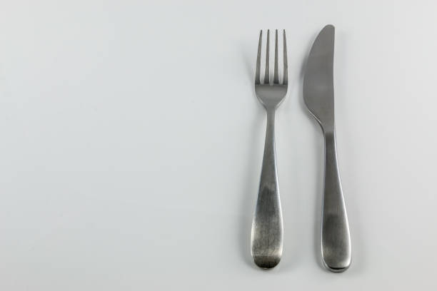istock Steel cutlery with knife and fork 1016567338