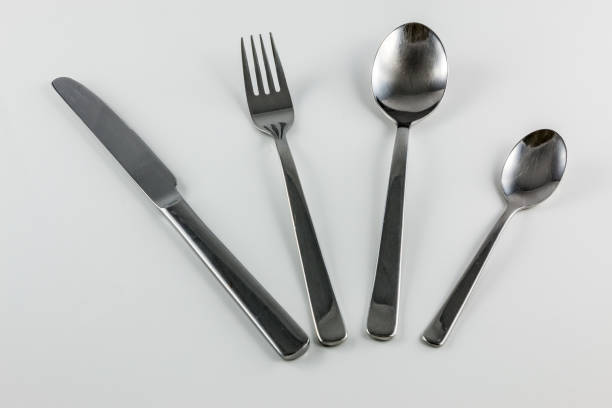 istock Cutlery with knife, fork, table spoon and little spoon 1016567512