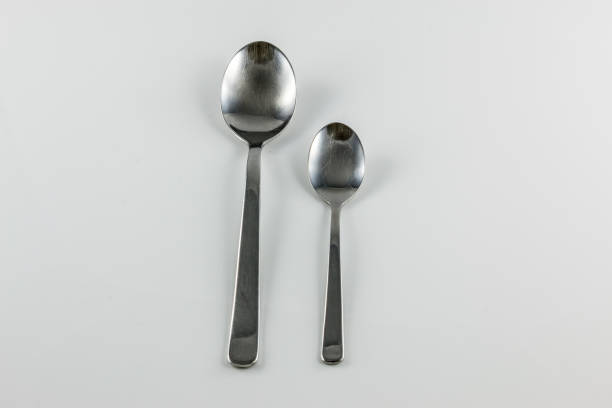 istock Steel cutlery with table spoon and little spoon 1016567628