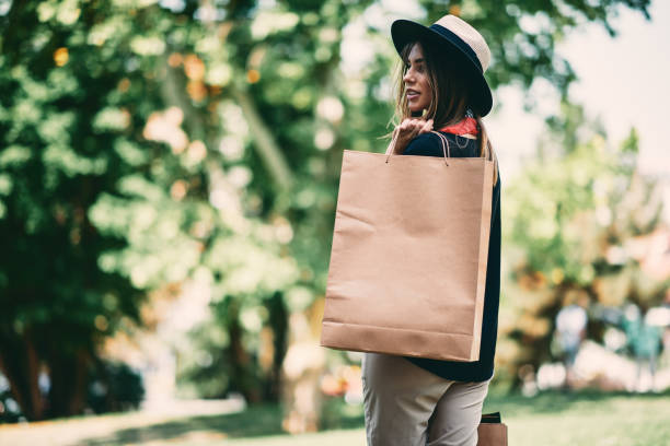 Woman holding paper bags.