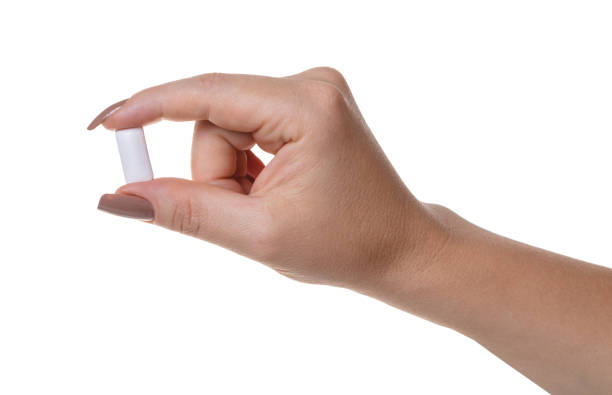 istock chewing gum in a female hand 1016568212