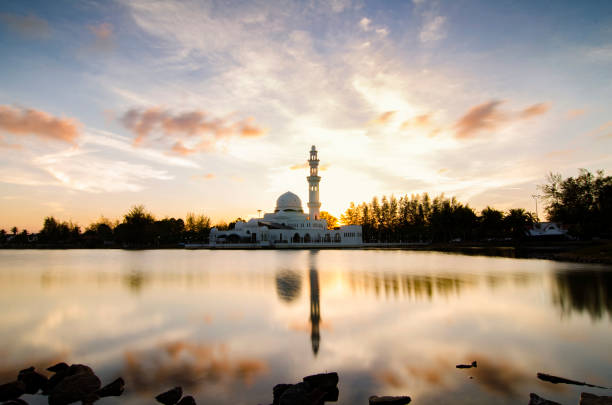 istock silhouette and reflection of mosque over magical sunset 1016571892