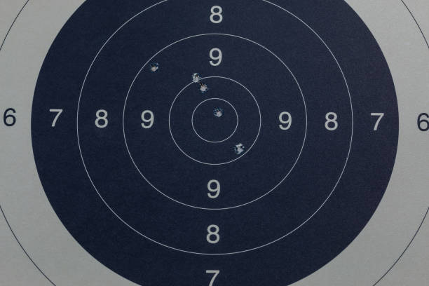 istock Bullet holes in the black target 1016577666
