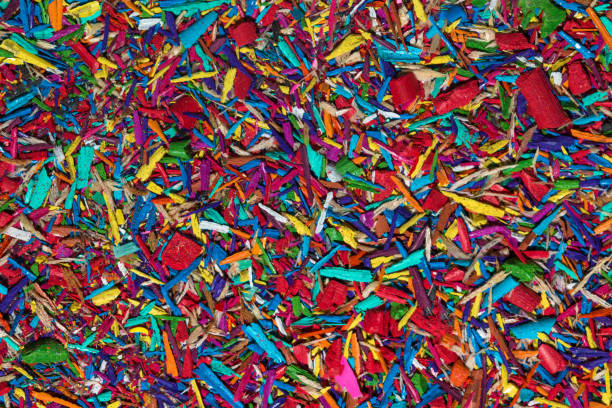 istock Colourful graphite pencils and shavings background 1016582912