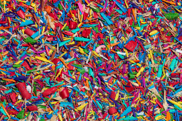 istock Colourful graphite pencils and shavings background 1016582922