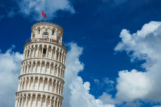 Visiting the famous Leaning Tower of Pisa Pisa, Italy - April 30, 2018: Sightseeing in Tuscany. Tourists at the top of the famous Leaning Tower of Pisa among clouds pisa leaning tower of pisa tower famous place stock pictures, royalty-free photos & images