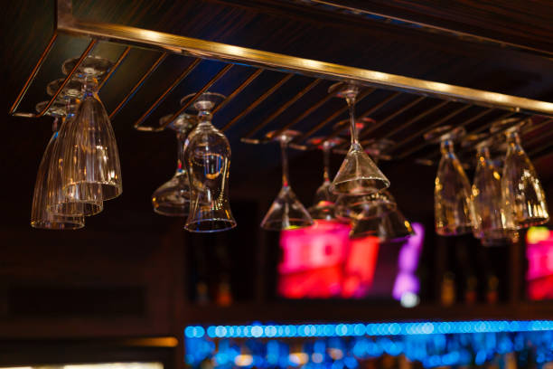 istock Empty glasses for wine above a bar rack in vintage tone. 1016589152
