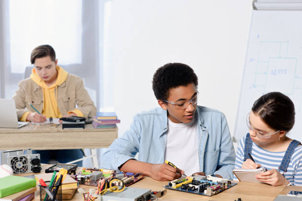 istock multicultural teenagers fixing computer motherboard at home 1016589450