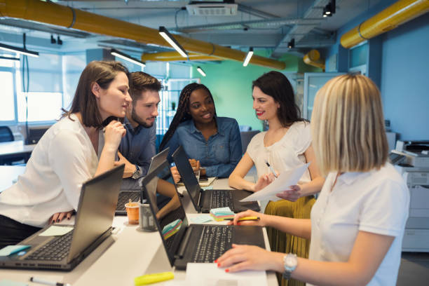 istock Young coworkers in modern office 1016589480