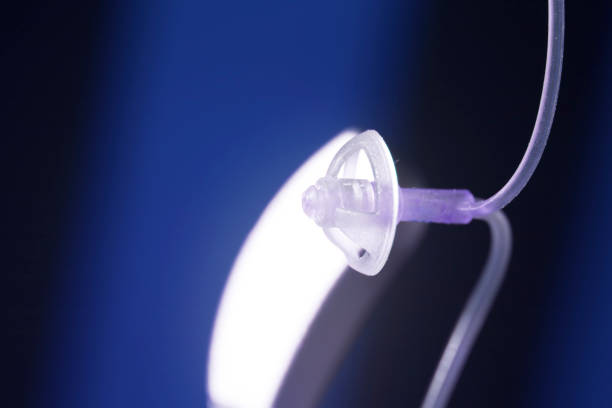 istock Audiophone modern high technology deafness equipment in the ear digital hearing aid closeup isolated. 1016598832