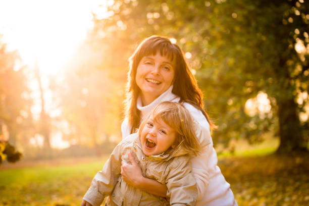 istock Mother and child together in autumn 1016598918