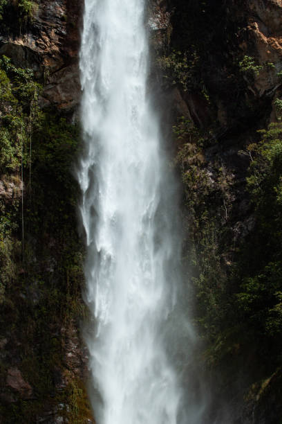 istock Selective focus on Water curtain with Dark moss in the background. Long exposure shot. 1016599366