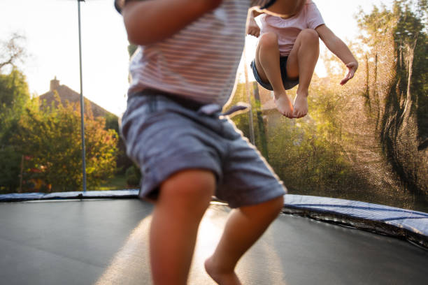 istock Children jumping on trampoline, closeup shot. 1016602038