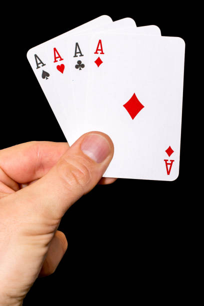 istock Four aces playing poker in front of black background 1016605710
