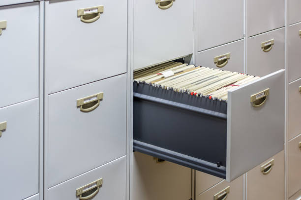 File cabinet with a wide open drawer full of files Office, file storage filing cabinet photos stock pictures, royalty-free photos & images