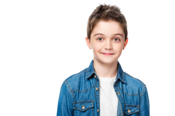 istock adorable cheerful schoolboy looking at camera isolated on white 1016623160