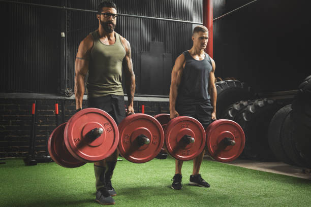 istock Muscular men during competition in the farmer's walk exercise 1016623192