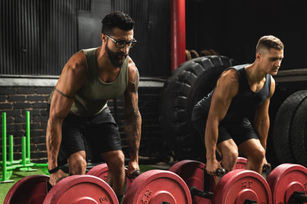 istock Muscular men during competition in the farmer's walk exercise 1016623218