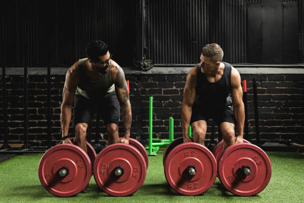 istock Muscular men during competition in the farmer's walk exercise 1016623224