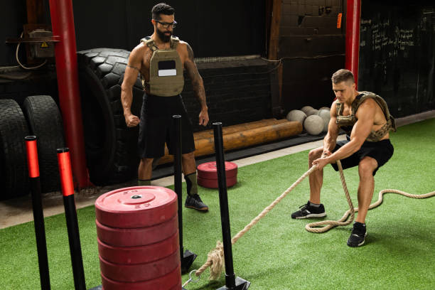 istock Sled drag exercise. Sportsman during his cross training workout. 1016623376