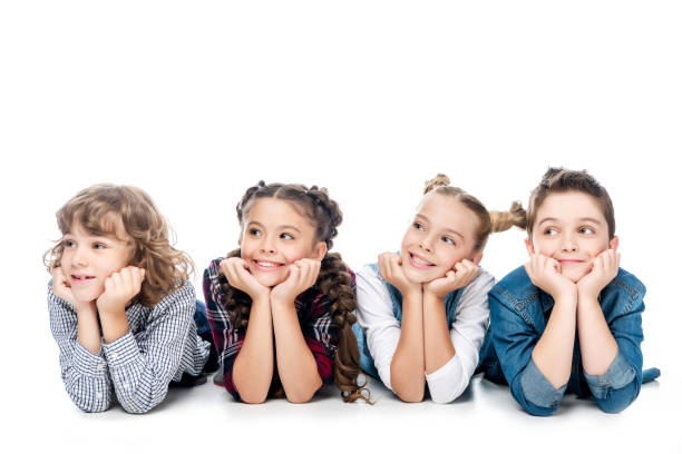 istock classmates resting chins on hands and looking away isolated on white 1016623430