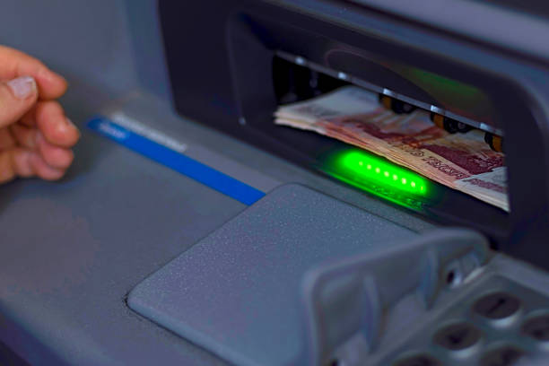 istock A bundle of paper money is inserted into the open ATM receiver 1016628694