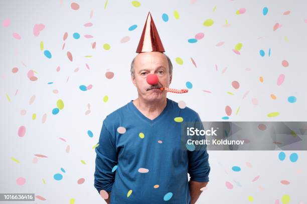 Senior Man Sad And Disappointed Because Nobody Came To Celebrate His Anniversary Stock Photo - Download Image Now