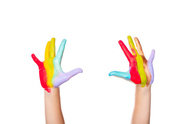 istock cropped image of schoolboy showing painted hands isolated on white 1016640802